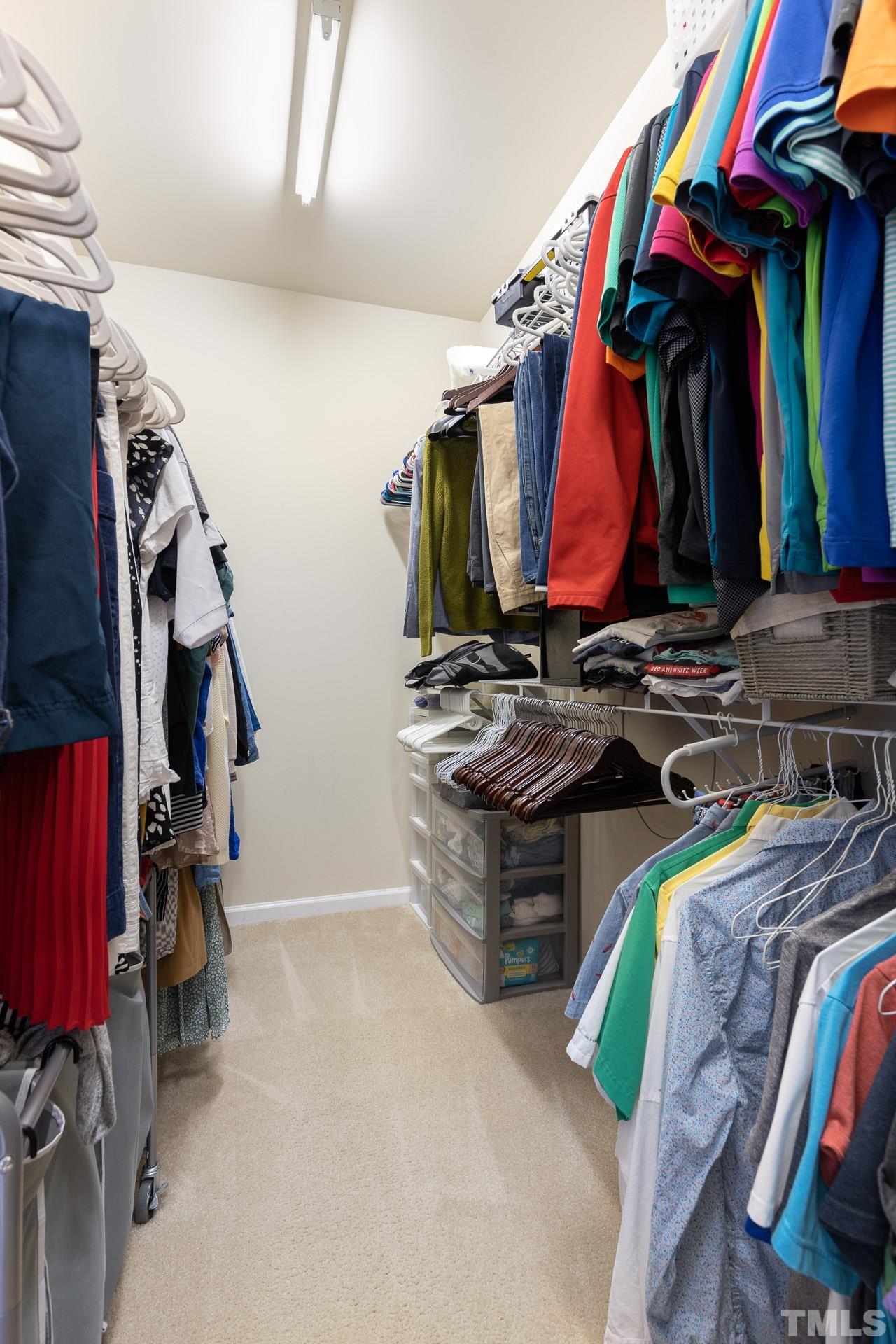 1148 Chapanoke Road Raleigh, NC 27603 - Photo 26 of 47 a view of walk in closet with clothes and shoes