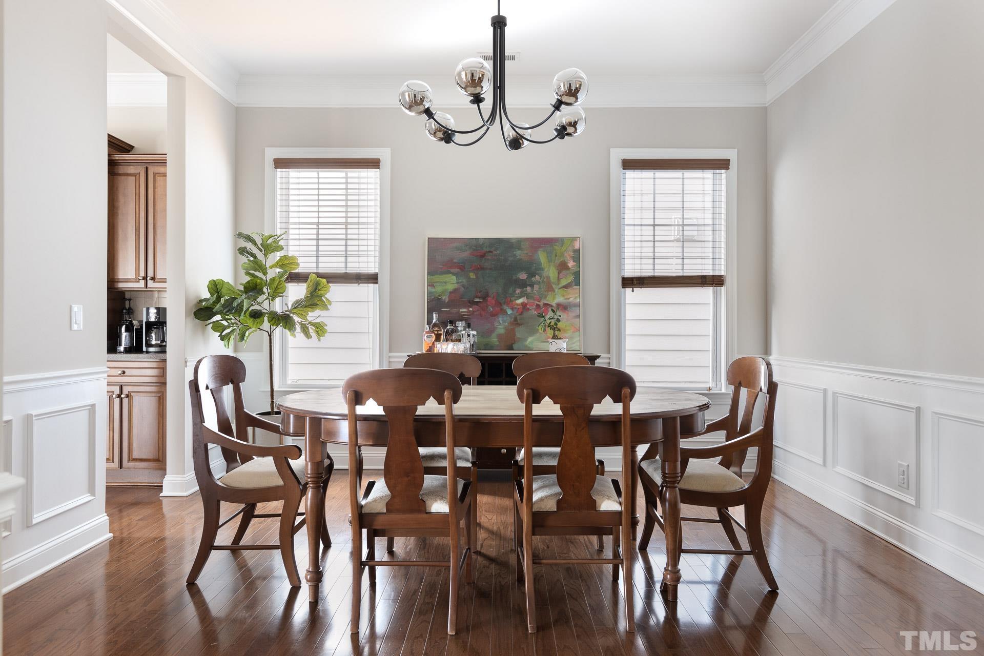 1148 Chapanoke Road Raleigh, NC 27603 - Photo 7 of 47 a view of a dining room with furniture window and wooden floor