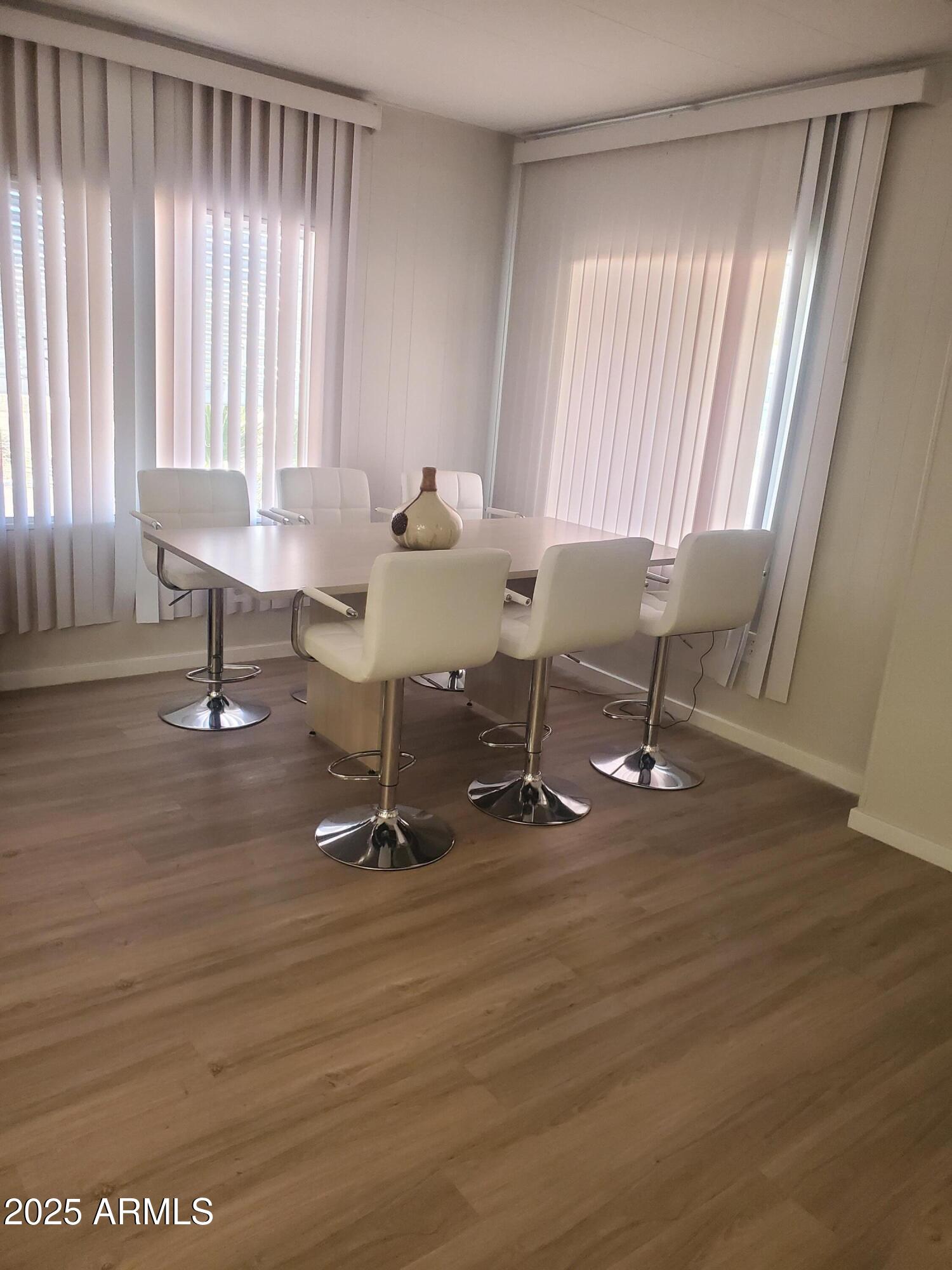 3300 East Broadway Road, Unit 128 Mesa, AZ 85204 - Photo 11 of 32 a view of a room with gym equipment and floor to ceiling window