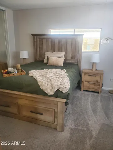 a bedroom with a bed and window
