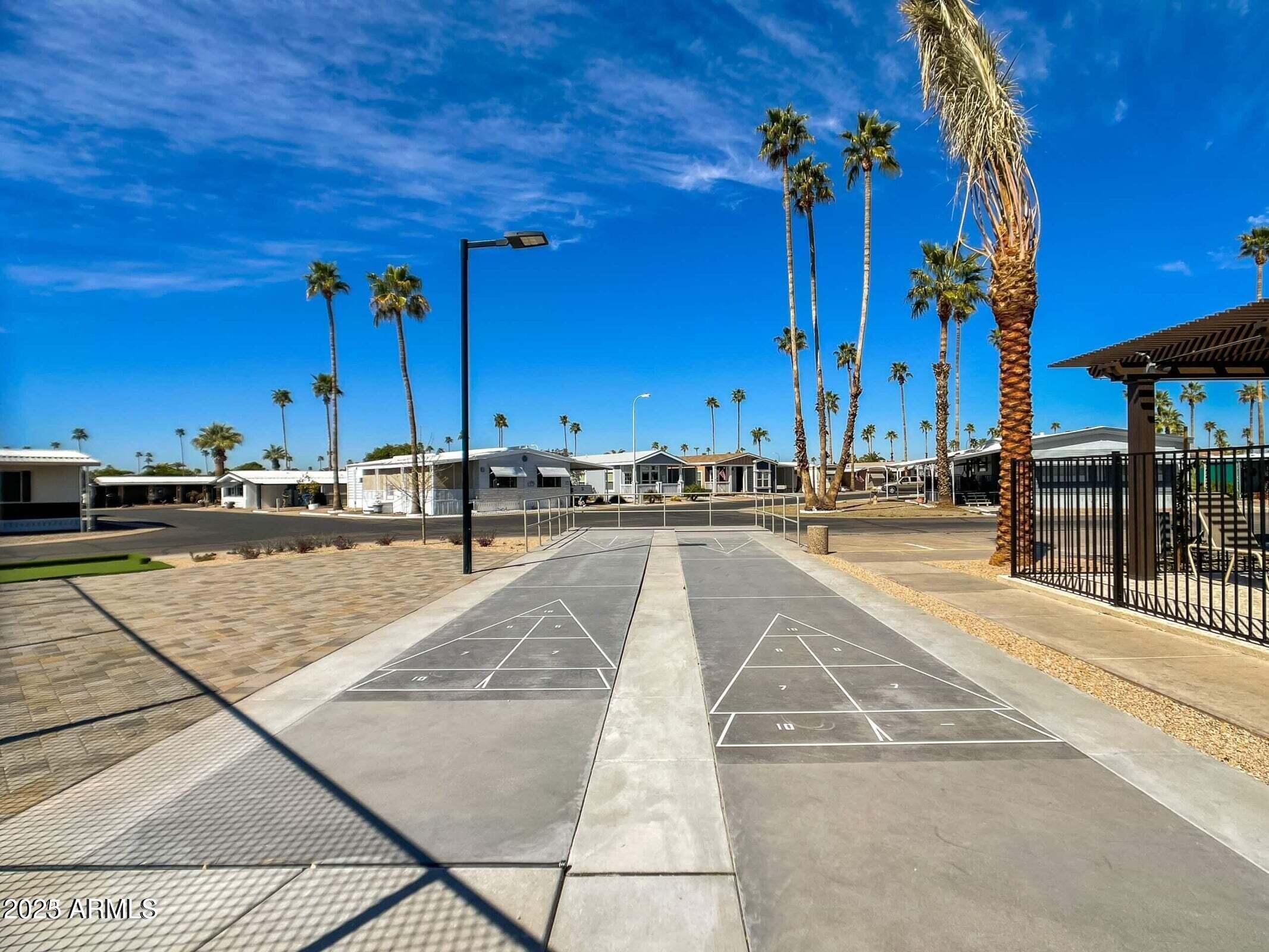 3300 East Broadway Road, Unit 128 Mesa, AZ 85204 - Photo 29 of 32 a view of a swimming pool with a lounge chairs