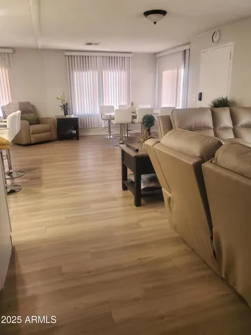 a living room with furniture and a large window