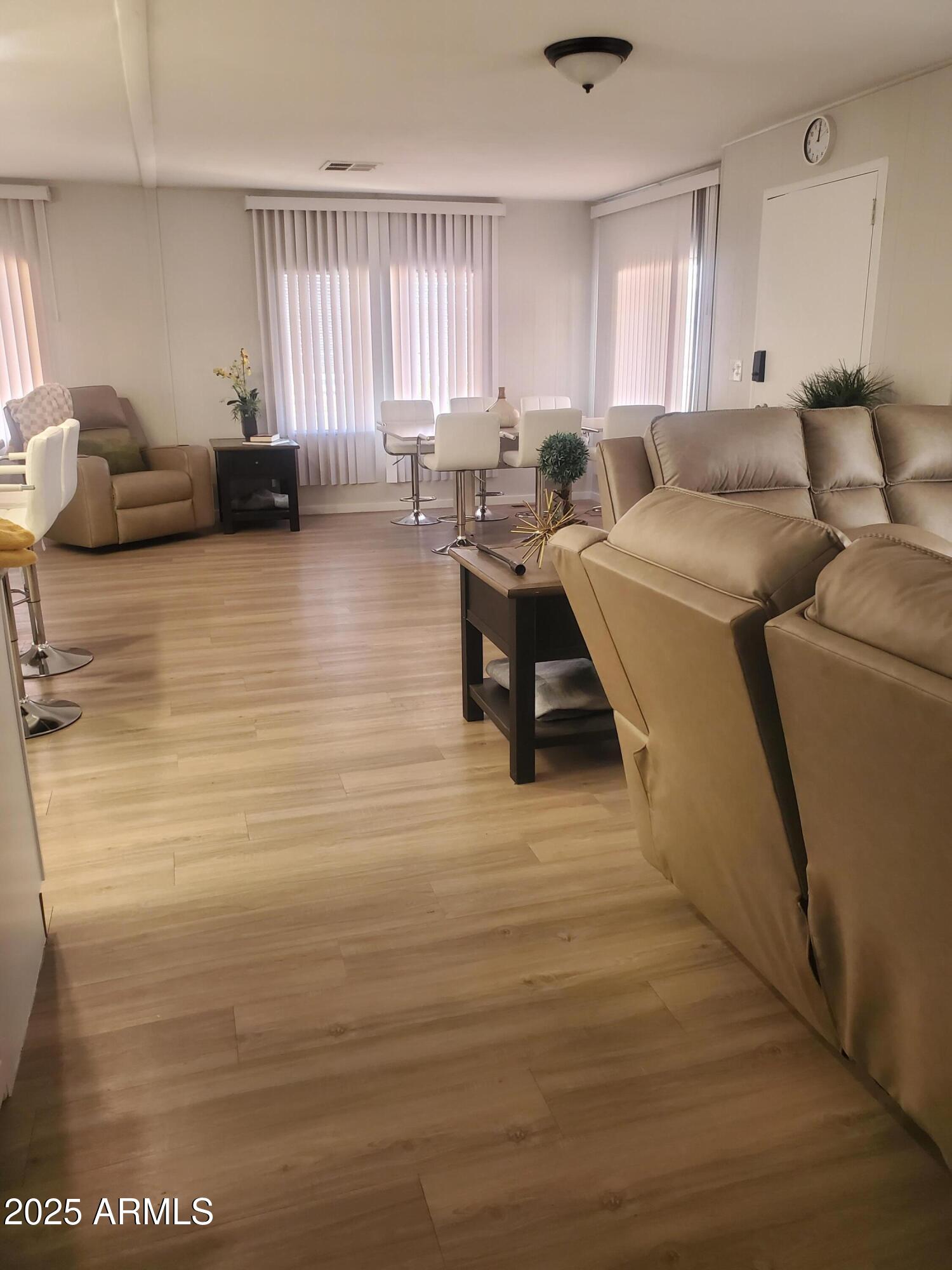 3300 East Broadway Road, Unit 128 Mesa, AZ 85204 - Photo 9 of 32 a living room with furniture and a large window