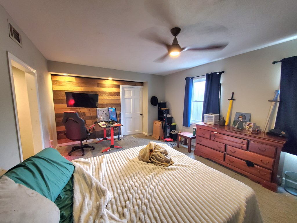 192 Mill Pond Court Jasper, GA 30143 - Photo 17 of 29 a bed room with a bed and a large mirror