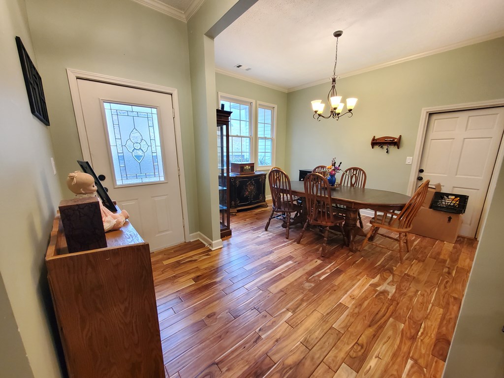 192 Mill Pond Court Jasper, GA 30143 - Photo 2 of 29 a living room with furniture and a wooden floor