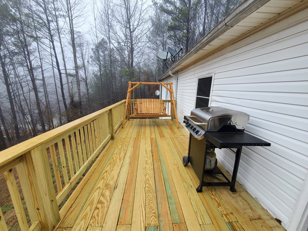 192 Mill Pond Court Jasper, GA 30143 - Photo 24 of 29 a view of balcony with wooden floor and outdoor seating