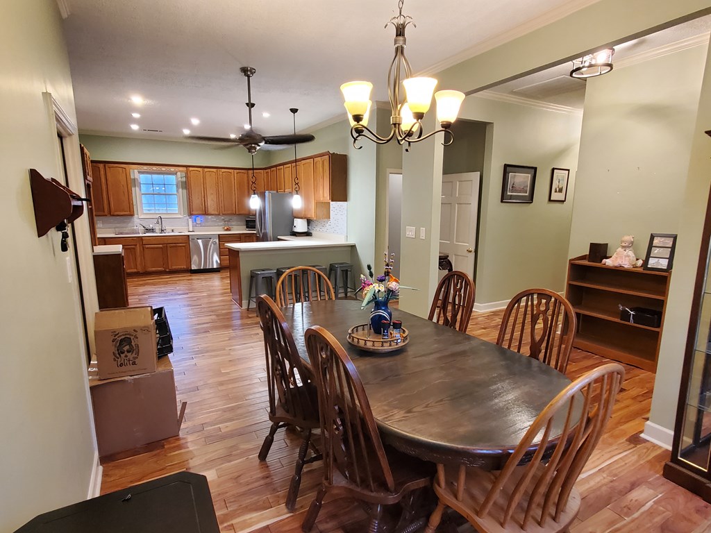 192 Mill Pond Court Jasper, GA 30143 - Photo 7 of 29 a view of a dining room with furniture and chandelier