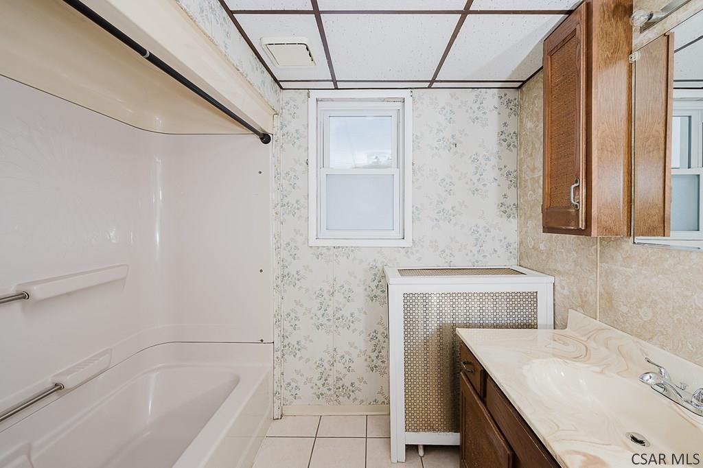 159 Wilson Street Johnstown, PA 15906 - Photo 17 of 27 a bathroom with a sink a vanity and shower