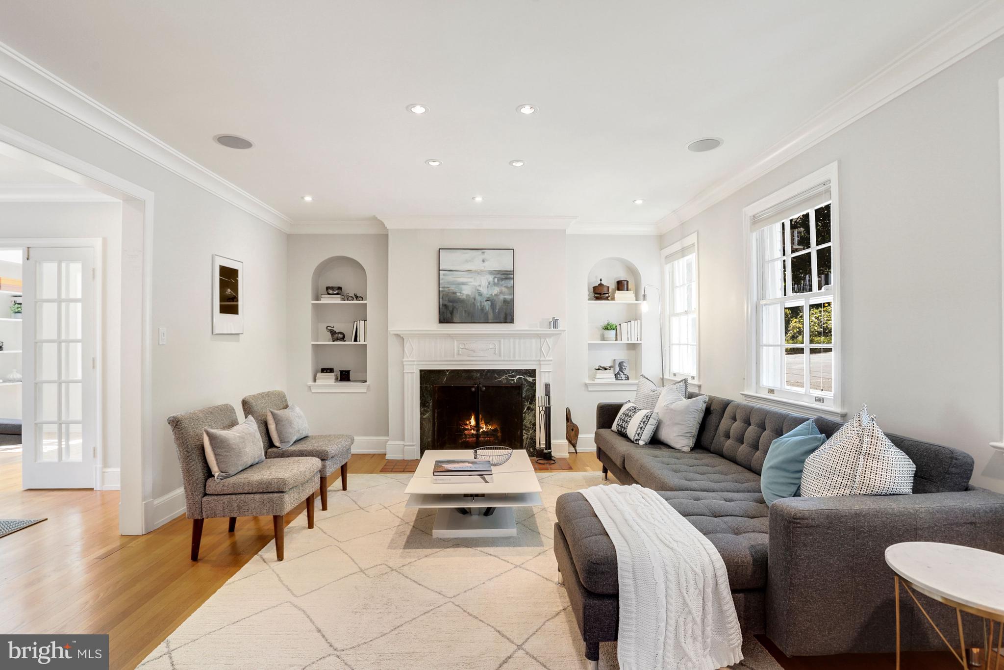 LR has gorgeous built ins, wood burning fireplace