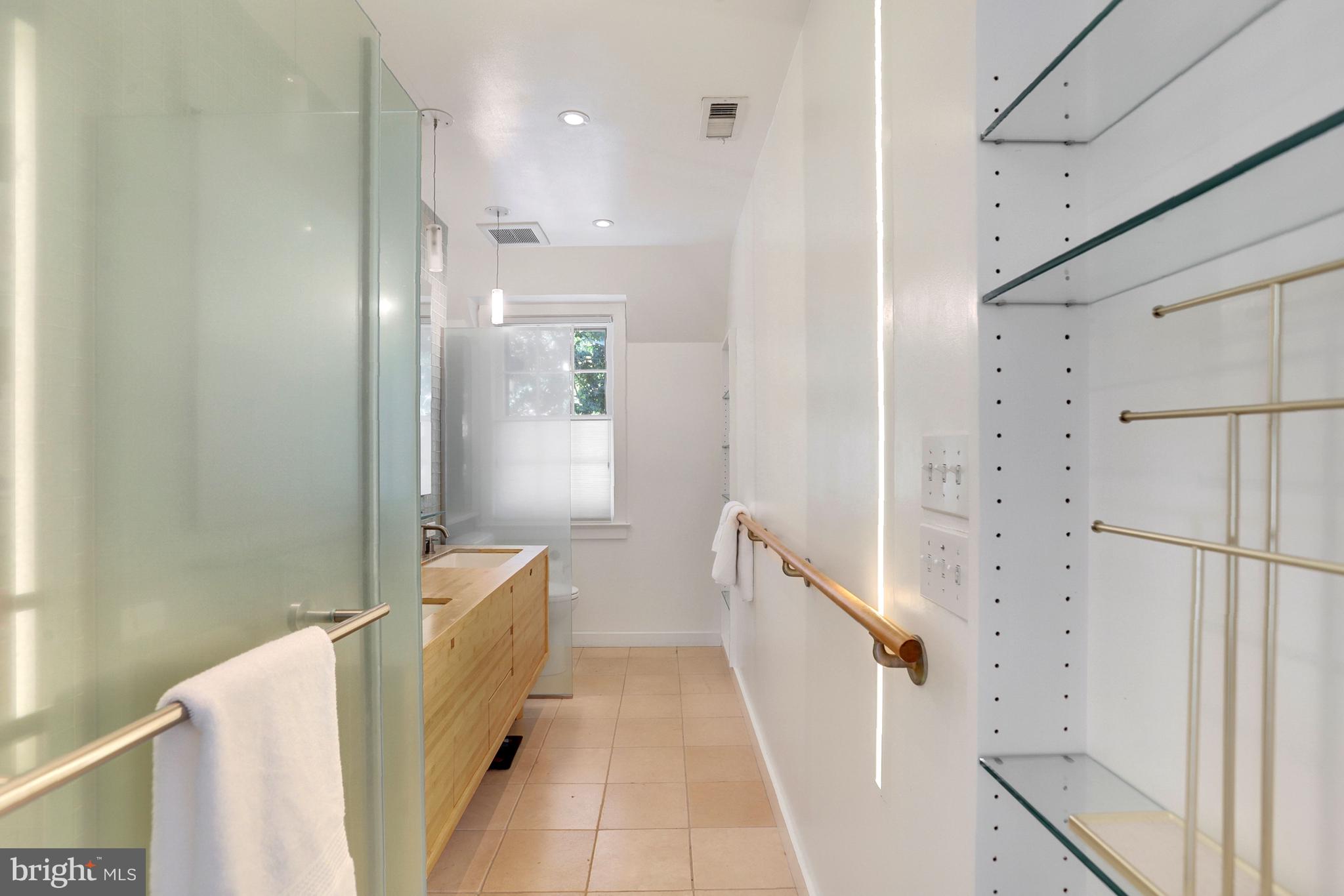 3501 30th Street Northwest Washington, DC 20008 - Photo 15 of 41 Primary bathroom with halogen lighting, double sin
