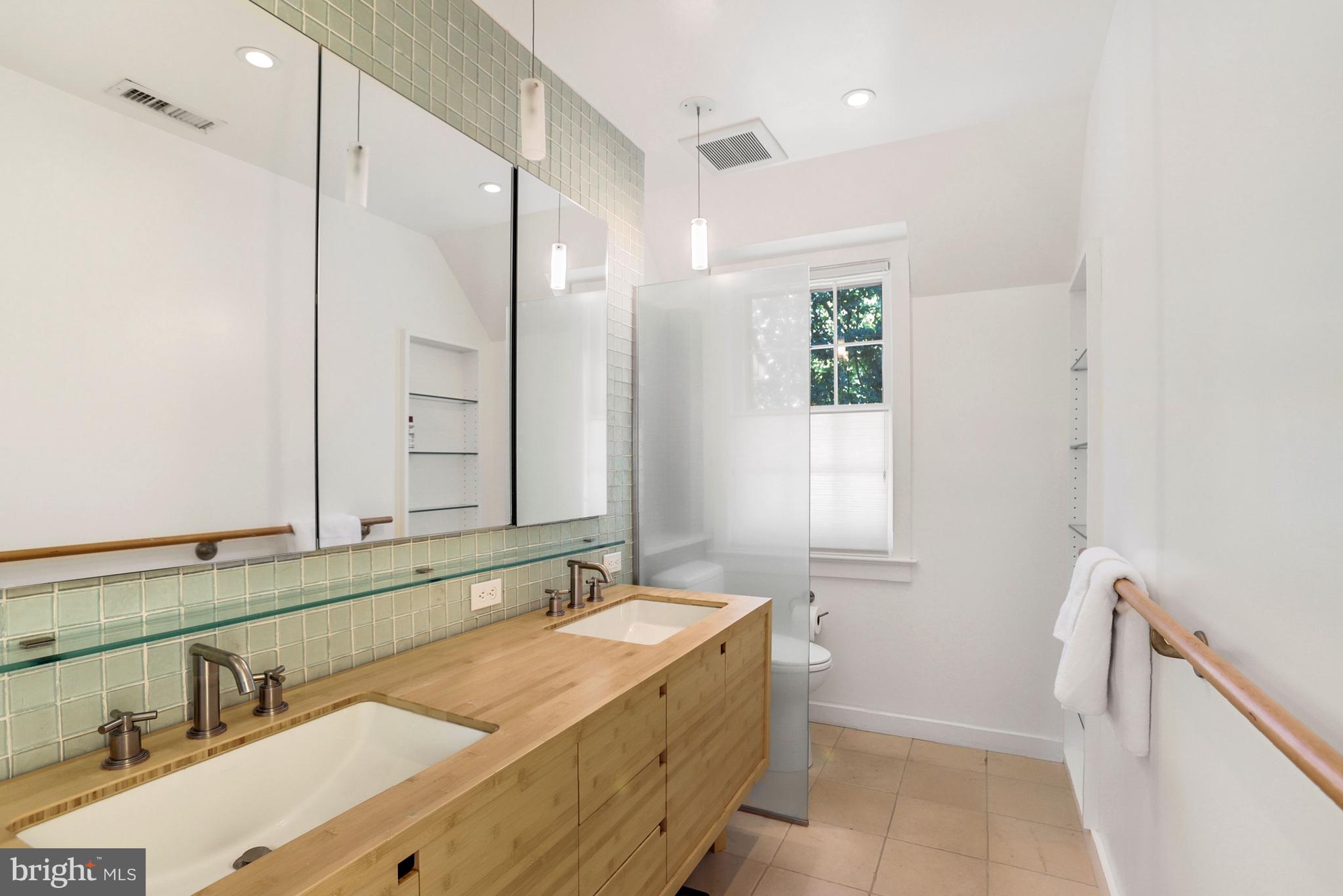 3501 30th Street Northwest Washington, DC 20008 - Photo 16 of 41 Primary bath, wonderful light, sleek double sinks.