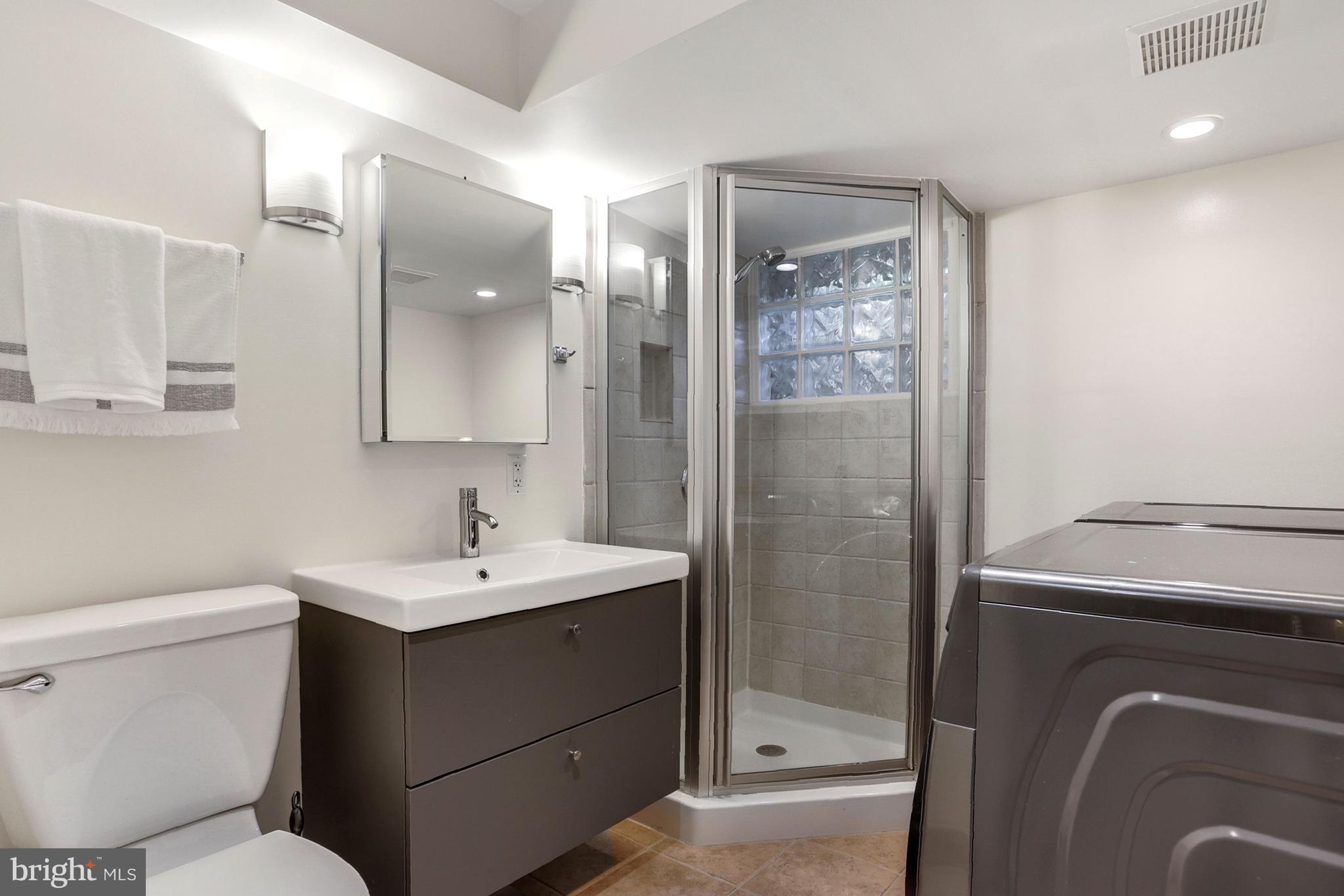 3501 30th Street Northwest Washington, DC 20008 - Photo 30 of 41 Fourth bath is nicely lit and holds the washer and