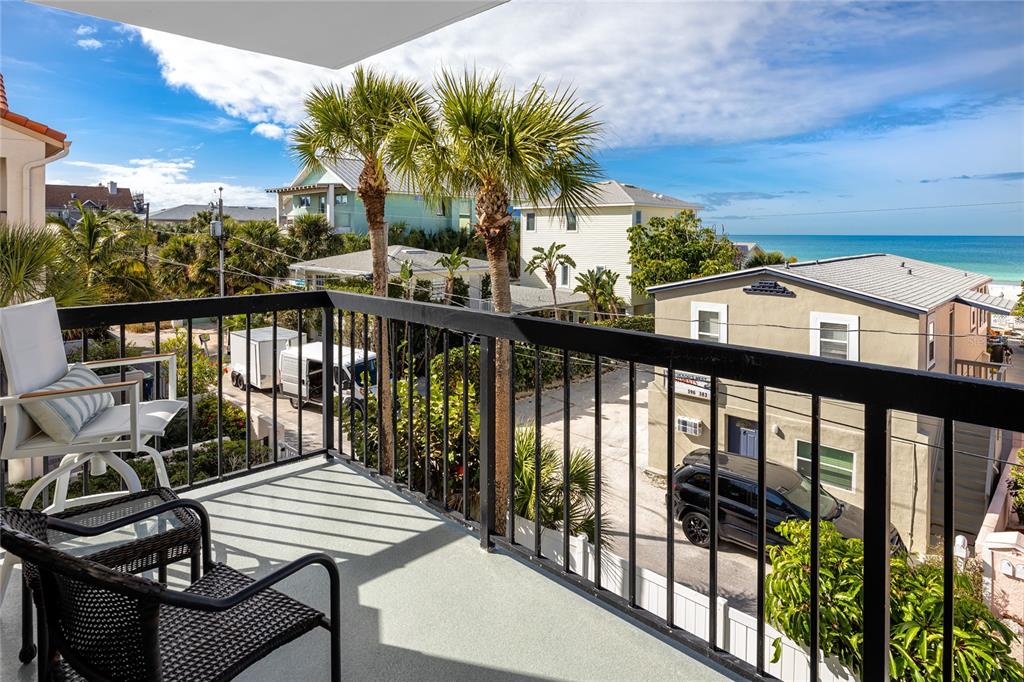1300 Gulf Boulevard, Unit 301 Indian Rocks Beach, FL 33785 - Photo 13 of 46 a view of a balcony with wooden floor