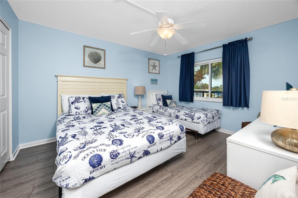 1300 Gulf Boulevard, Unit 301 Indian Rocks Beach, FL 33785 - Photo 18 of 46 a bedroom with double bed and a window
