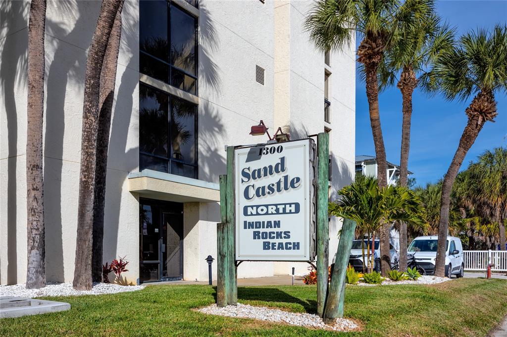 1300 Gulf Boulevard, Unit 301 Indian Rocks Beach, FL 33785 - Photo 25 of 46 a view of a sign board with a yard