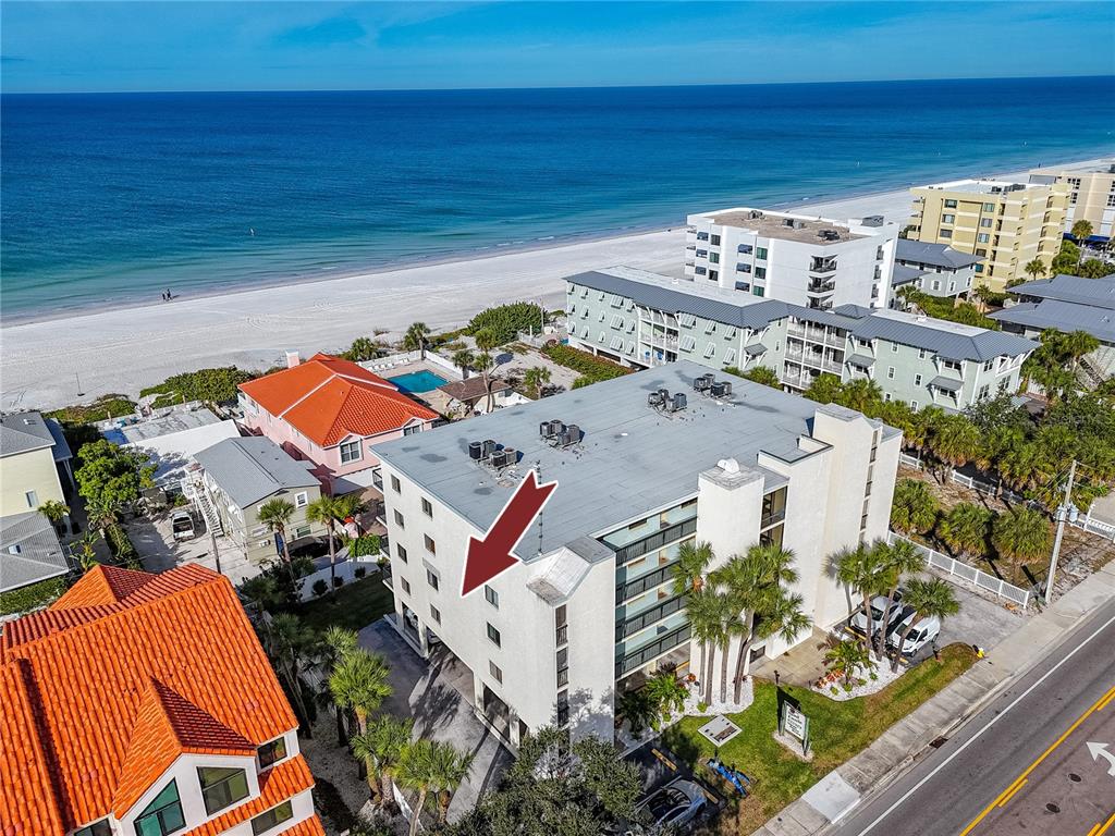 1300 Gulf Boulevard, Unit 301 Indian Rocks Beach, FL 33785 - Photo 42 of 46 an aerial view of a house with a ocean view