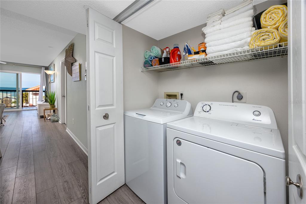 1300 Gulf Boulevard, Unit 301 Indian Rocks Beach, FL 33785 - Photo 8 of 46 a utility room with dryer and washer