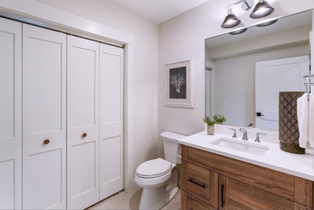 165 Atlantic Road, Unit 2 Gloucester, MA 01930 - Photo 11 of 19 a bathroom with a sink a toilet and vanity
