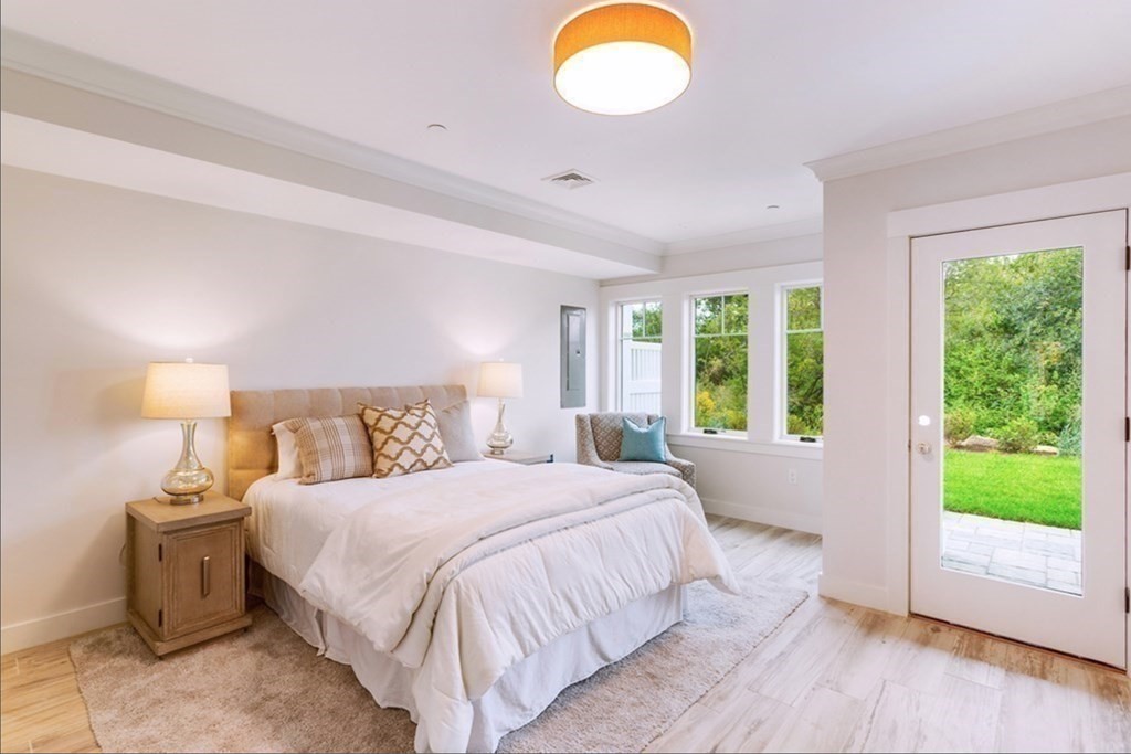 165 Atlantic Road, Unit 2 Gloucester, MA 01930 - Photo 10 of 19 a bedroom with a bed and a windows