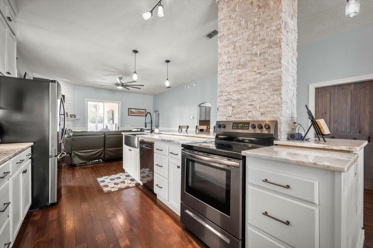 1701 Keswick Road St. Augustine, FL 32084 - Photo 14 of 57 a kitchen with a stove oven and sink
