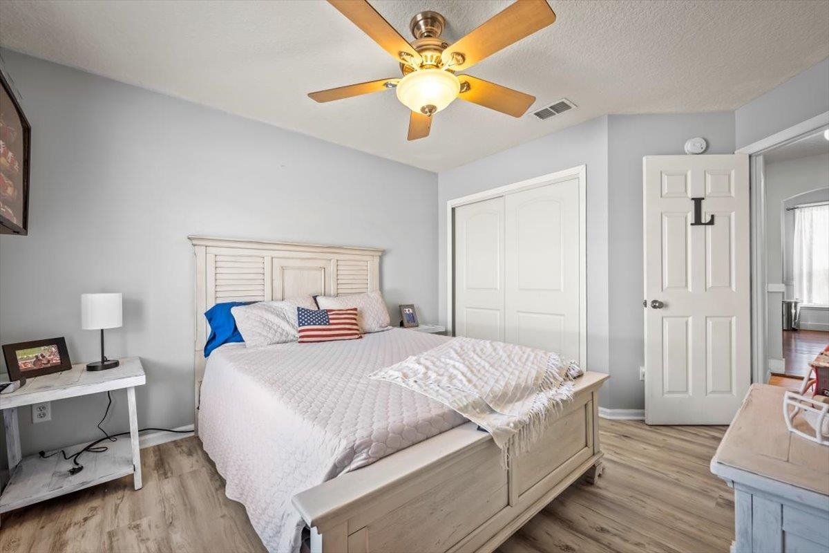 1701 Keswick Road St. Augustine, FL 32084 - Photo 20 of 57 a bedroom with a bed and a chandelier