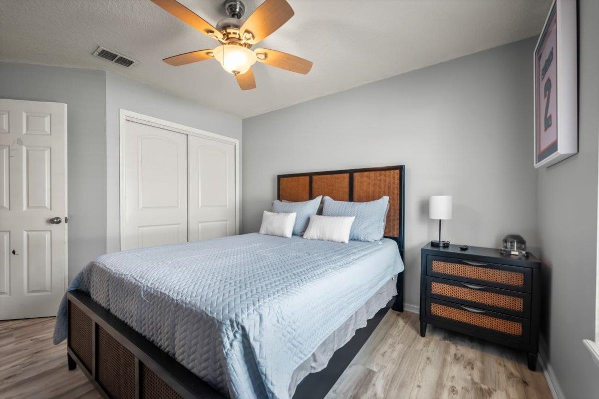1701 Keswick Road St. Augustine, FL 32084 - Photo 23 of 57 a bedroom with bed and a chandelier