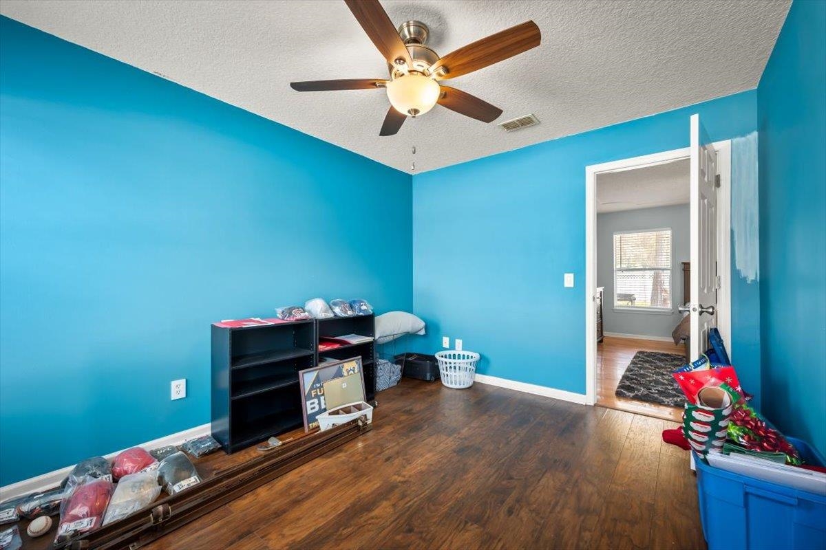 1701 Keswick Road St. Augustine, FL 32084 - Photo 25 of 57 a living room with furniture and a chandelier