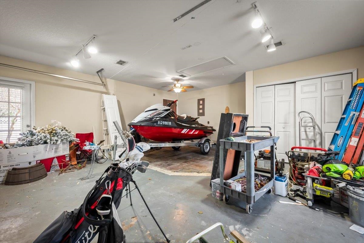 1701 Keswick Road St. Augustine, FL 32084 - Photo 27 of 57 a view of a garage with a bike and a table