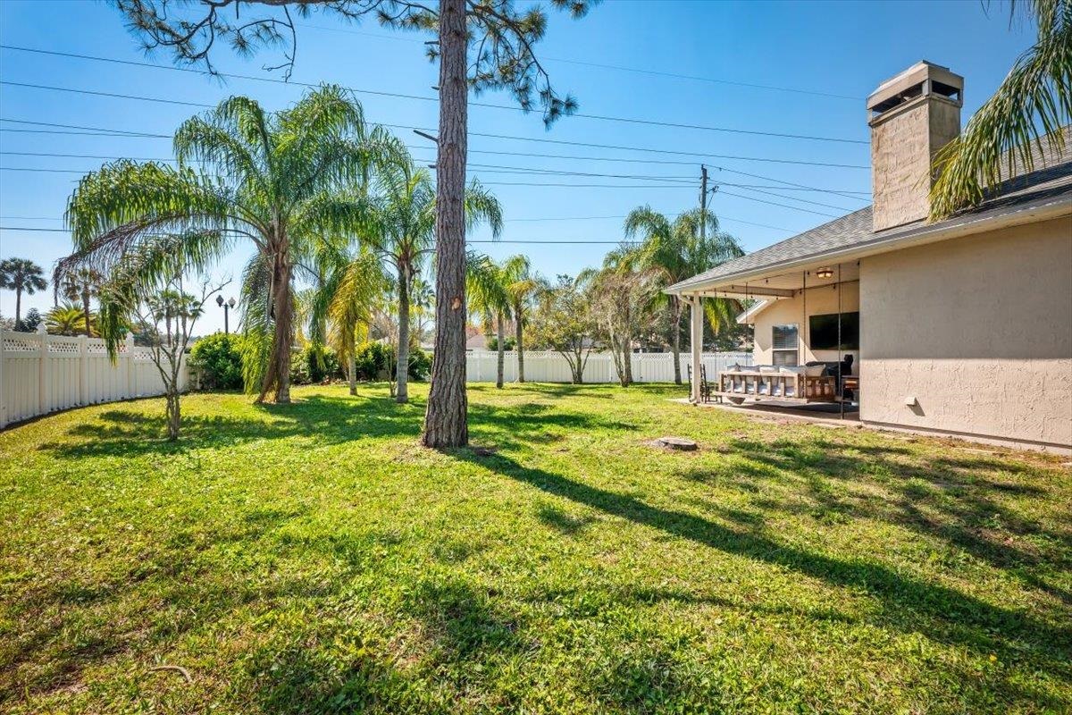 1701 Keswick Road St. Augustine, FL 32084 - Photo 31 of 57 a swimming pool with outdoor seating and yard