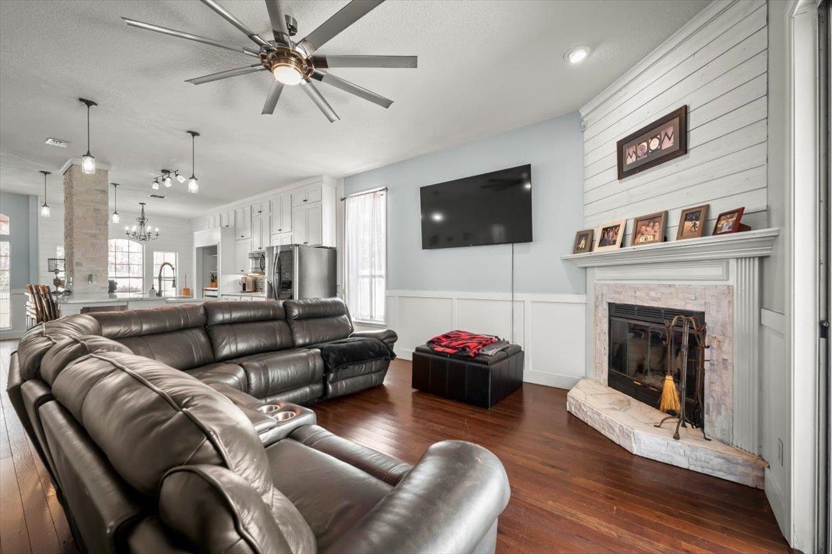 1701 Keswick Road St. Augustine, FL 32084 - Photo 4 of 57 a living room with furniture a flat screen tv and a fireplace