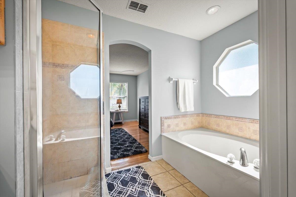 1701 Keswick Road St. Augustine, FL 32084 - Photo 6 of 57 a bathroom with a tub and shower