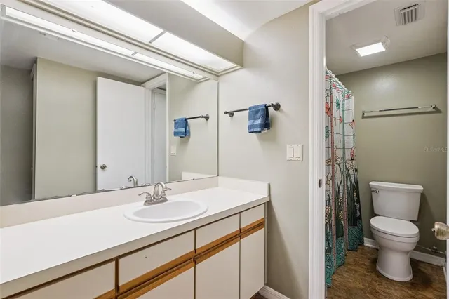 a bathroom with a shower and a toilet