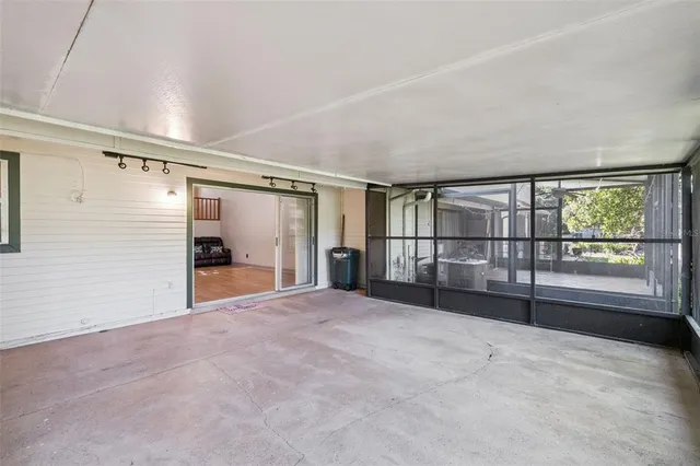 a view of an empty room with a large window