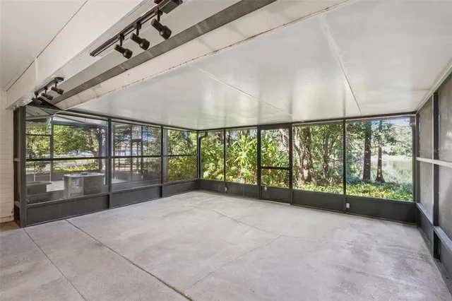 a view of an empty room with a large window