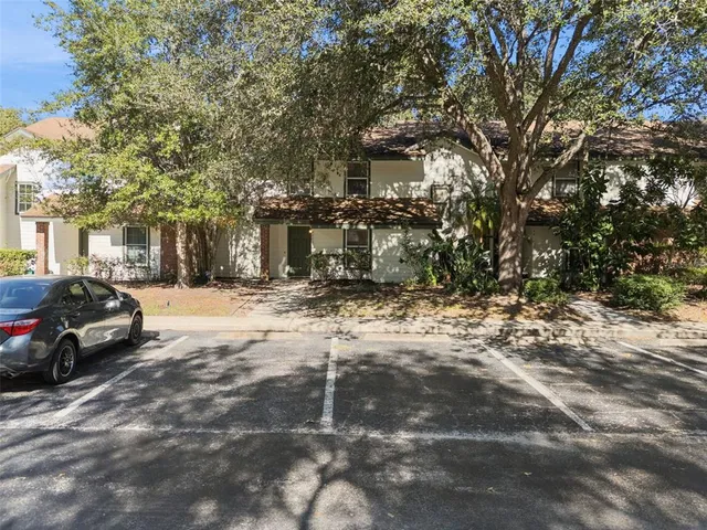 a view of a street with a car parked in front of it