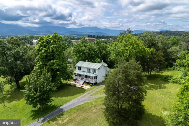 a view of a house with a big yard