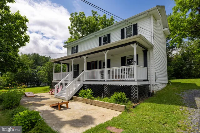 a dining room with wooden floor and glass table