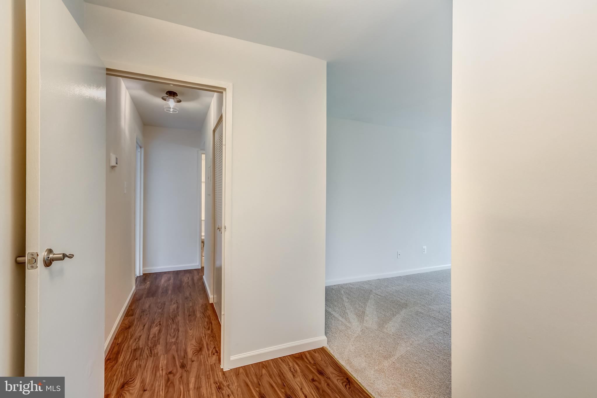 2012 Colts Neck Road, Unit 1A Reston, VA 20191 - Photo 2 of 23 Foyer with LR to the right