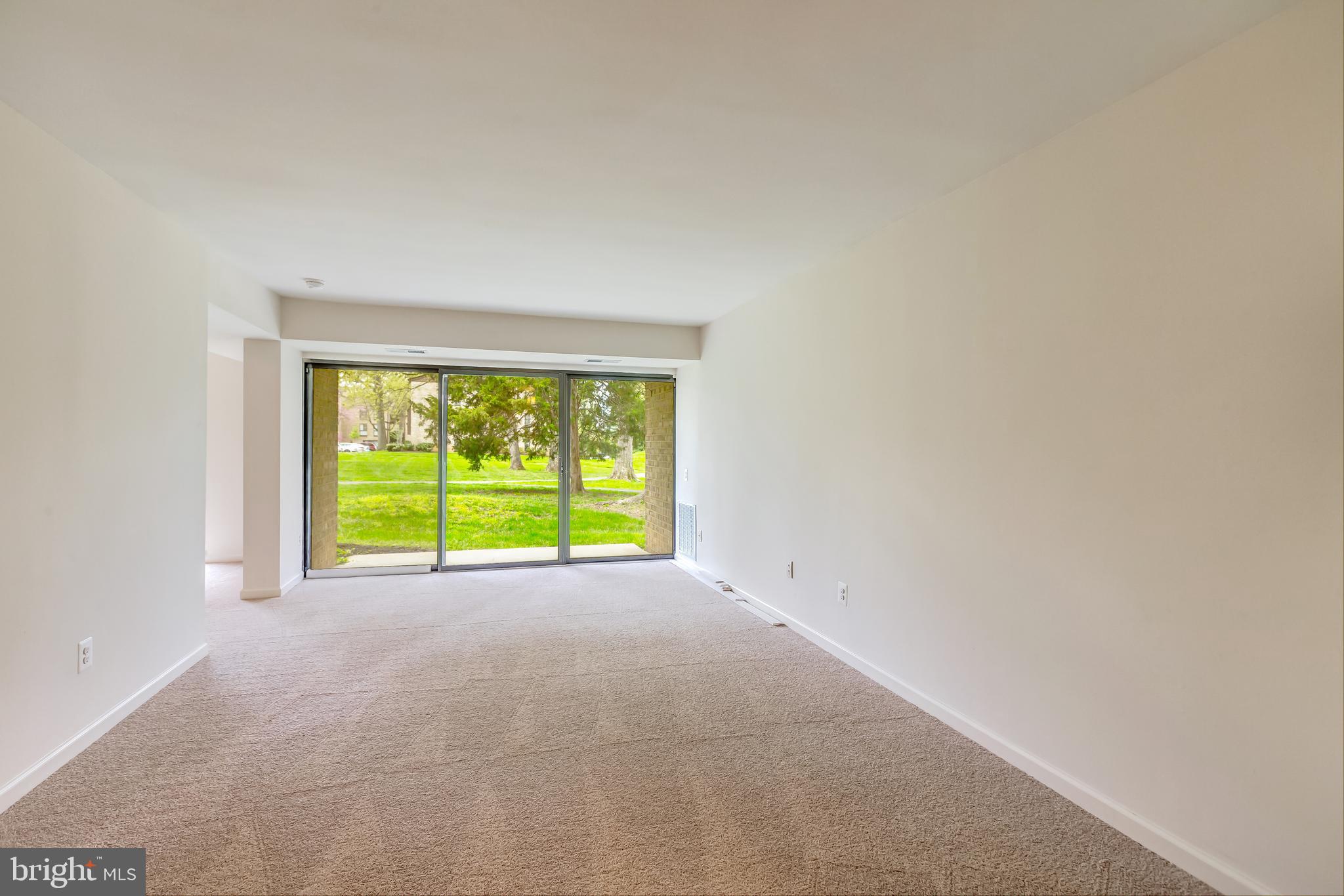 2012 Colts Neck Road, Unit 1A Reston, VA 20191 - Photo 3 of 23 Spacious living room that opens to patio