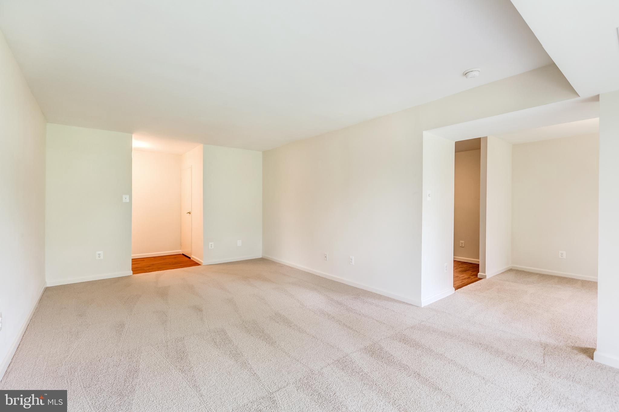 2012 Colts Neck Road, Unit 1A Reston, VA 20191 - Photo 7 of 23 Living room. To the Rt is kitchen and dining room