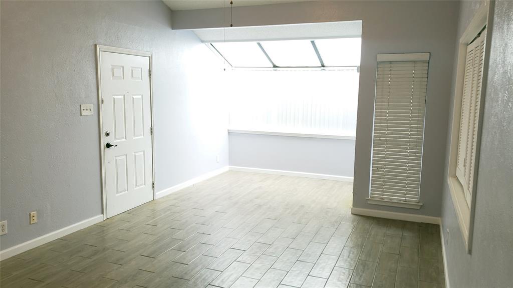 2105 Count Fleet Drive, Unit 212 Arlington, TX 76011 - Photo 2 of 14 a view of an empty room with a window