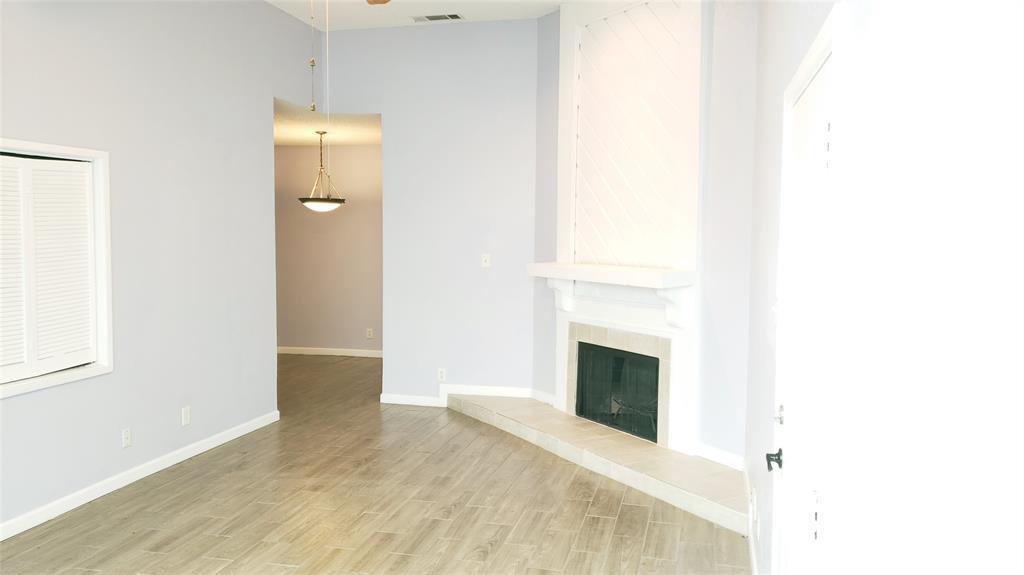 2105 Count Fleet Drive, Unit 212 Arlington, TX 76011 - Photo 3 of 14 a view of a livingroom with a fireplace