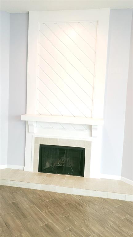 2105 Count Fleet Drive, Unit 212 Arlington, TX 76011 - Photo 4 of 14 a white building with a fireplace