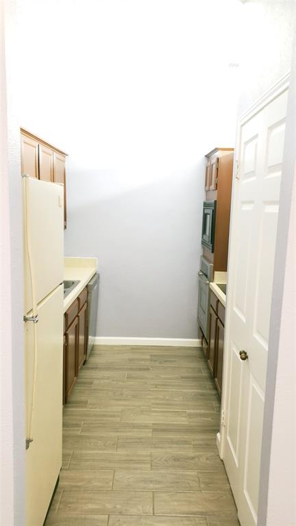 2105 Count Fleet Drive, Unit 212 Arlington, TX 76011 - Photo 6 of 14 a view of hallway with washer and dryer