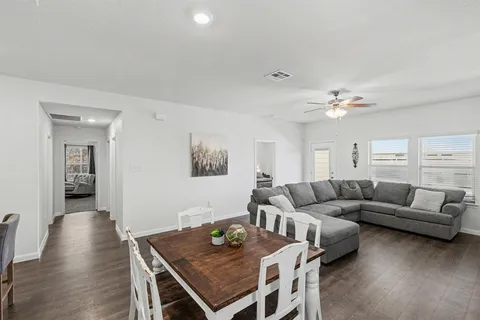 a kitchen with stainless steel appliances granite countertop a sink refrigerator and cabinets
