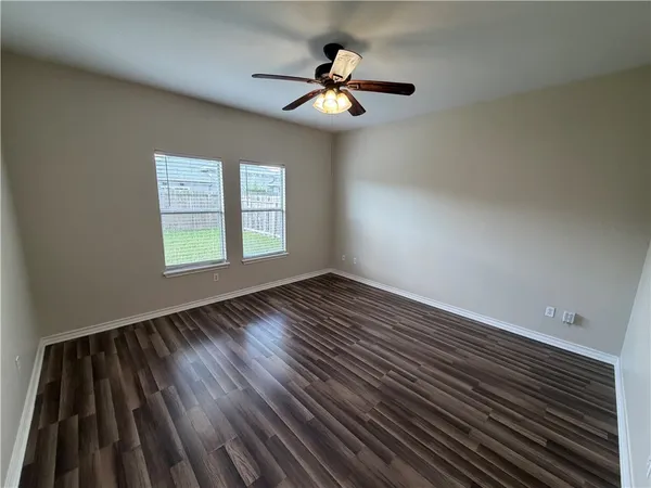 a white toilet sitting next to a bath tub