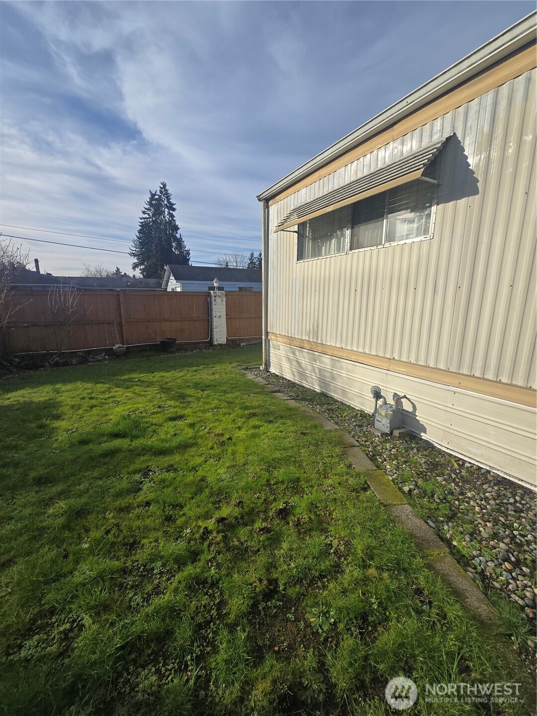 2302 R Street Southeast, Unit 80 Auburn, WA 98002 - Photo 32 of 32 a view of a back yard of the house