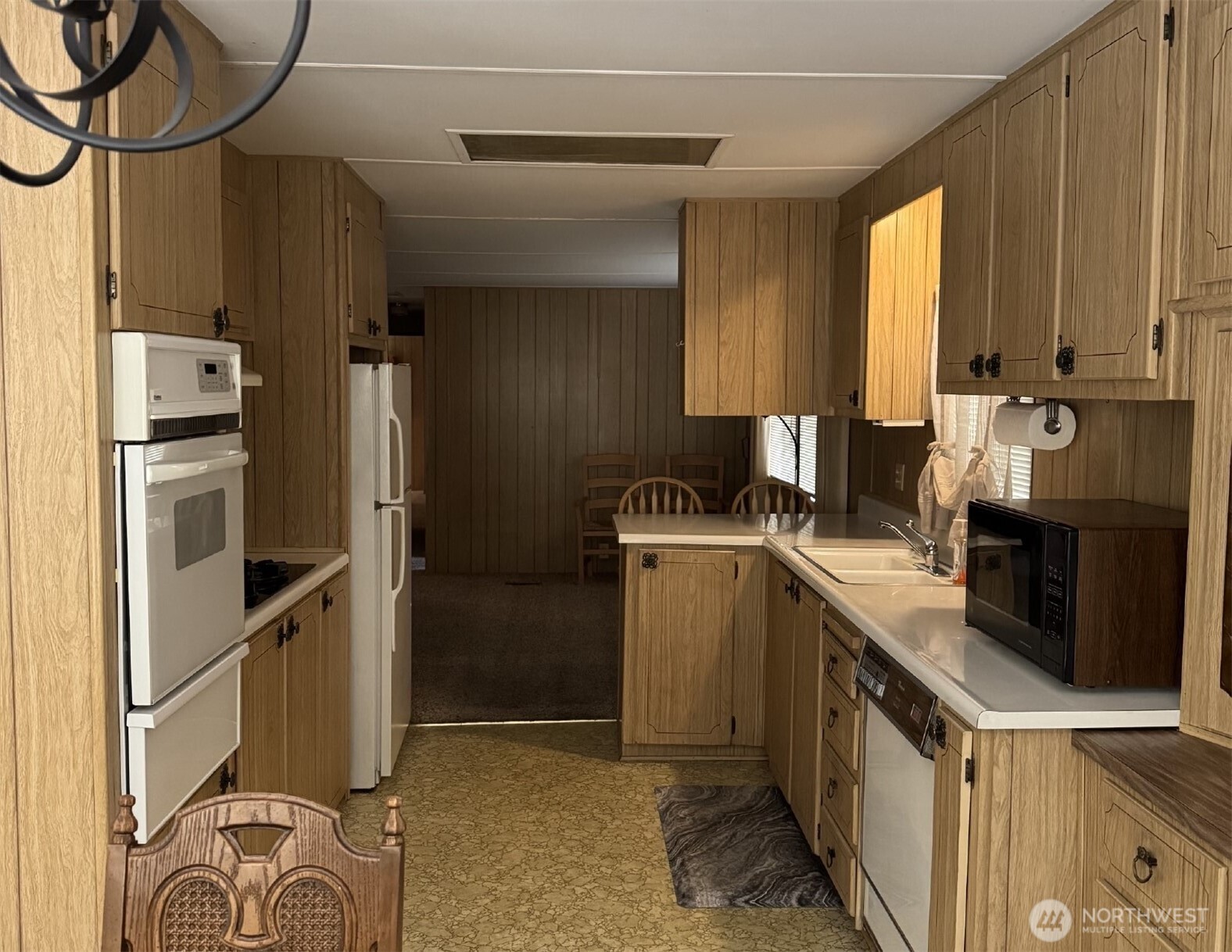 2302 R Street Southeast, Unit 80 Auburn, WA 98002 - Photo 8 of 32 a kitchen with a refrigerator and a sink