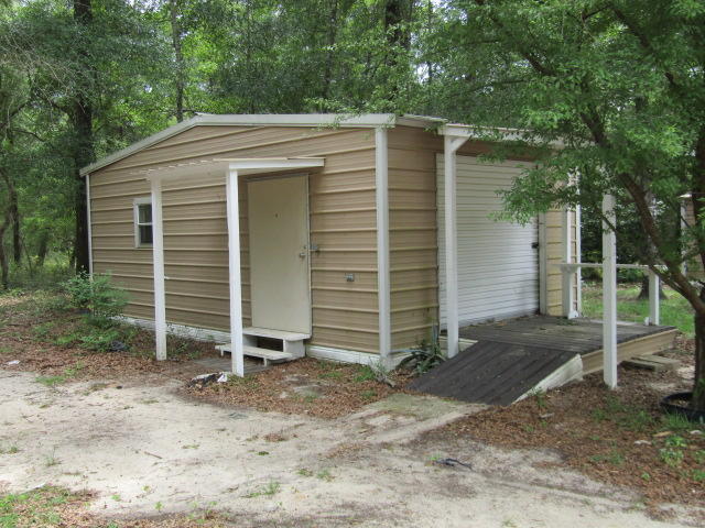 1112 Country Living Road Baker, FL 32531 - Photo 15 of 16 a view of a house with a yard
