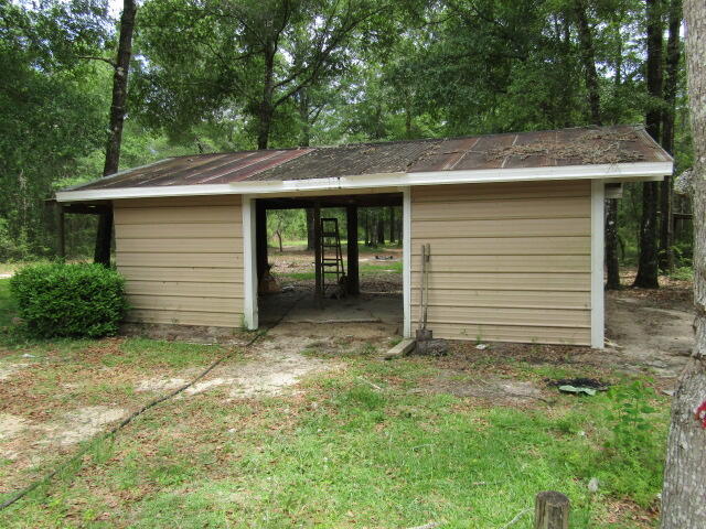 1112 Country Living Road Baker, FL 32531 - Photo 16 of 16 a view of a house with a yard